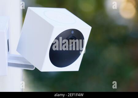 A house security camera mounted by a front door Stock Photo