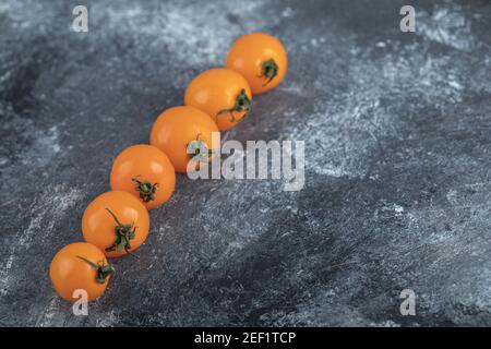 Fresh organic cherry tomatoes in a row Stock Photo