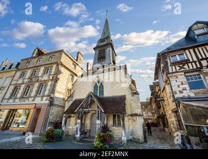 The medieval Maritime Museum, in the coastal city of Honfleur, France with shops and cobbled roads on both sides. Stock Photo
