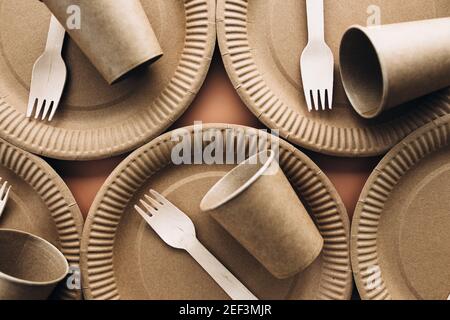 Various eco-friendly kraft paper packaging, fork, cup and plate, containers for takeaway food. Zero waste and recycling concept. High quality photo Stock Photo