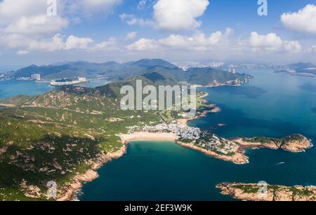 Dramatic aerial view of the Shek O beach and town in the south of Hong Kong island on a sunny day