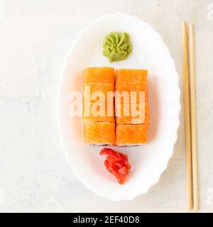 Philadelphia rolls. Japanese sushi food. Top view of sushi in white plate. Copy space. Soft focus. Top view Stock Photo
