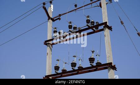 10 February 2021- Sikar, Jaipur, India. High voltage transformer substation with electrical insulator. Black insulator to protect short circuit and po Stock Photo