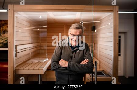 Haltern Am Germany. 11th Feb, 2021. The head of the sauna Müther, Müther, stands in front of a sauna in a showroom. The demand for private saunas is booming,