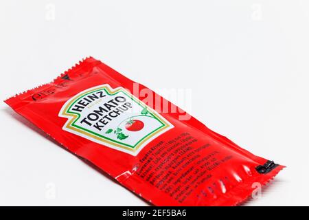 Umea, Norrland Sweden - January 21, 2021: a disposable package of tomato ketchup on a white background Stock Photo