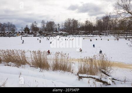 A lot of people ice fishing. Latvia, Liepaja 2013, january Stock Photo -  Alamy