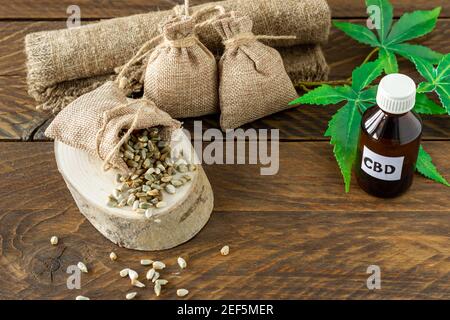 cannabis CBD oil hemp products - THC tincture and hemp leaves and seeds. Stock Photo