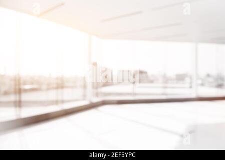 Blur empty white office room with glass wall, city building view Stock Photo