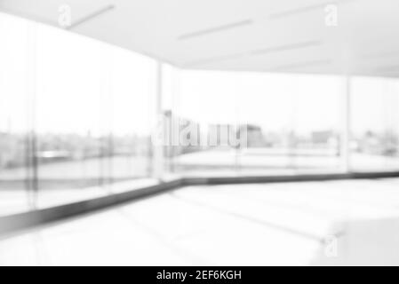 Blur empty white office room with glass wall, city building view Stock Photo