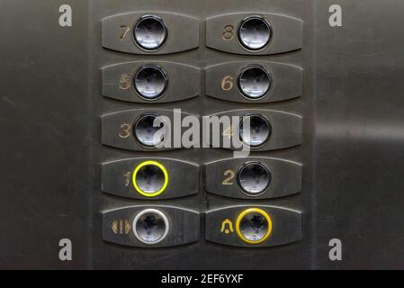 Stained elevator lift with worn, scratched and dirty stained buttons Stock Photo