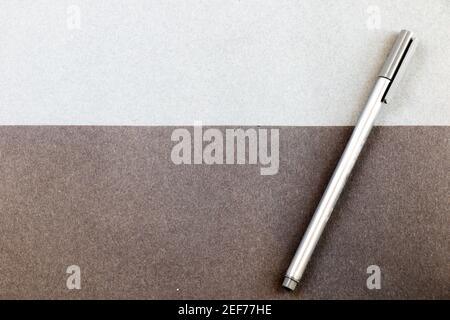 Grey pen on the black and gray papers background and texture, gray gradient Stock Photo