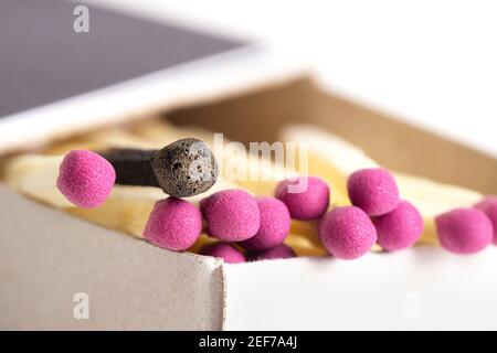 Close-up of matches in a matchbox. One matchstick is used. Selective focus. Stock Photo
