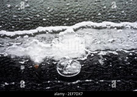 Closeup of a frozen rear windshield of a Lexus car in Lake Oswego, Oregon, on February 21, 2021, after snow and freezing rain hits Portland metro area. Stock Photo