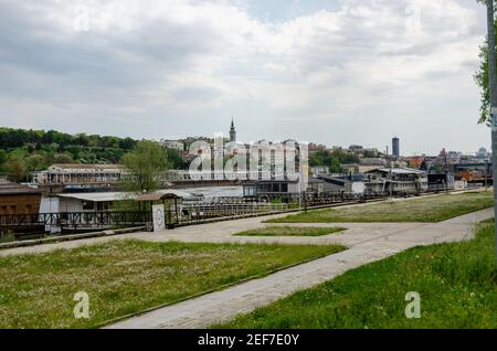 River barges floating at the confluence of rivers Sava and Danube in Belgrade, Serbia. River barges are popular as restaurants, bars and discos. Stock Photo