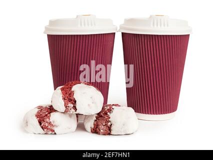 Two disposable pink coffee cups and delicious cookies on white background Stock Photo