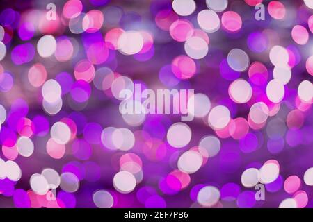 Purple and pink holiday circles bokeh abstract background Stock Photo