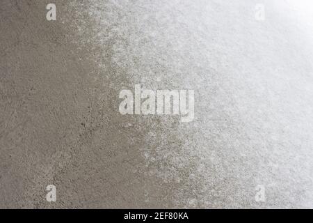 A thin layer of snow on the concrete deck. Stock Photo