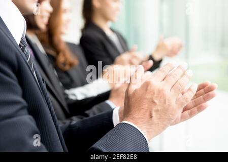 Group of business people giving an applause in the meeting Stock Photo