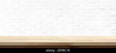 Wood table top on white brick wall background, panoramic banner - can be used for display or montage your products (food) Stock Photo