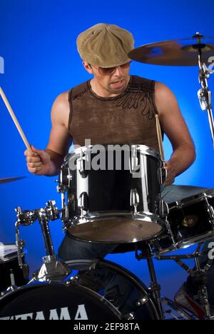 Male drummer playing drums Stock Photo