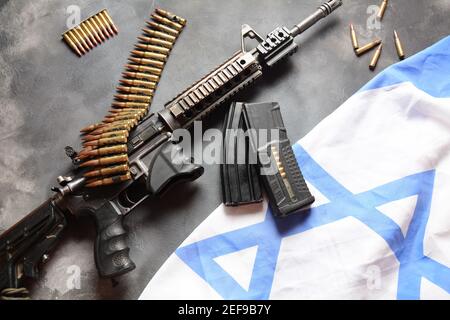 M4 carbine with Israeli flag on the background. Yom Ha'atzmaut Independence Day in Israel concept Stock Photo
