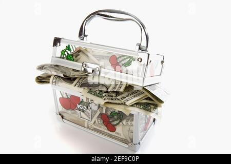 Close-up of a transparent box filled with paper currency Stock Photo