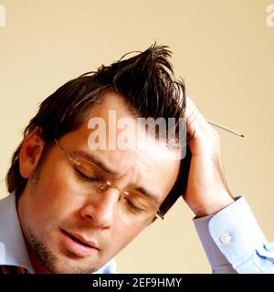 Close-up of a businessman holding a digitized pen Stock Photo