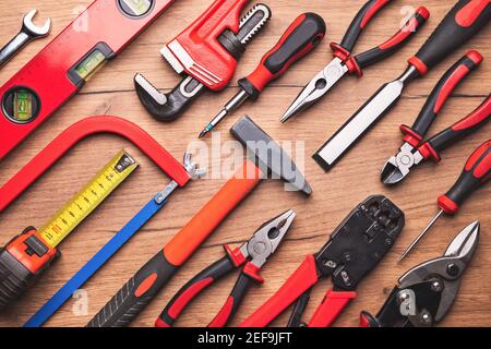 Assorted work tools on wooden background Stock Photo