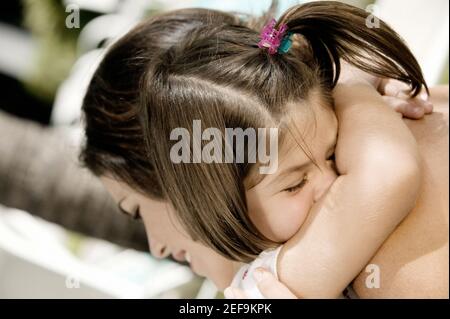 Close-up of a daughter hugging her mother Stock Photo