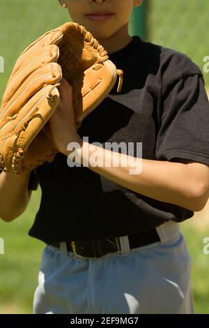 Close-up of a baseball player standing in a baseball field Stock Photo