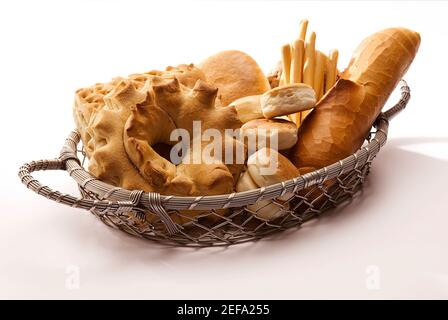 Close up of assorted breads in a wicker basket Stock Photo