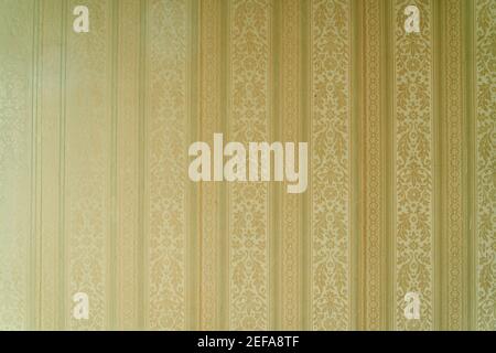 Old retro vintage floral wallpaper on wall as background texture Stock Photo