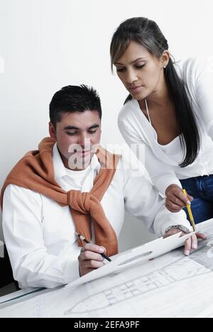 Two architects working on blueprints Stock Photo