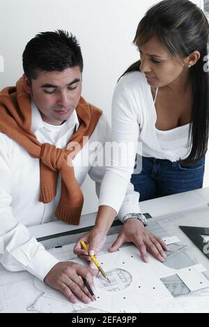 High angle view of two architects working on a blueprint Stock Photo
