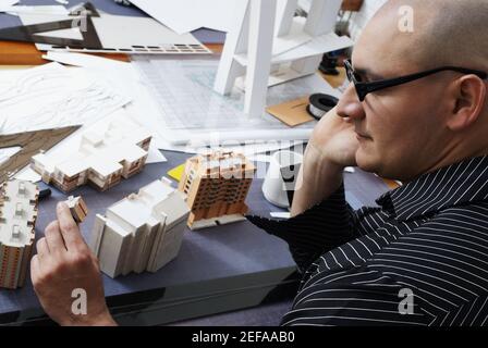 High angle view of a male architect looking at a buildingÅ½s model Stock Photo