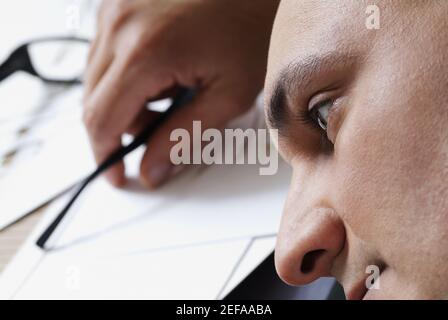 Close-up of a male architect resting in an office Stock Photo