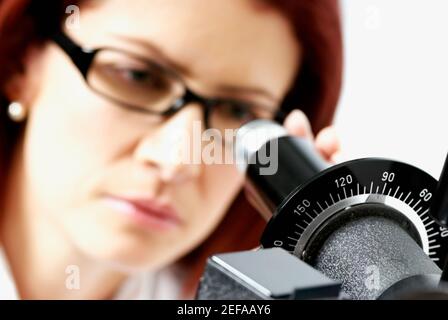 Close-up of a female optometrist using a phoropter Stock Photo