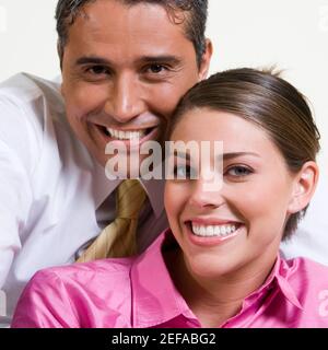 Portrait of a businessman and a businesswoman smiling Stock Photo