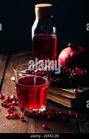 Glass of infusion with freshly squeezed pomegranate juice Stock Photo