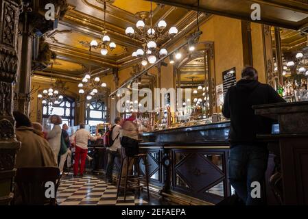 People in the traditional Iruña Cafe in Pamplona, Navarre, Spain. This Cafe was one of the prefered cafes of Ernest Hemingway Stock Photo