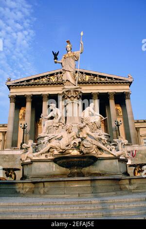 Fountain in front of a government building, Pallas Athena Fountain, Parliament Building, Vienna, Austria Stock Photo