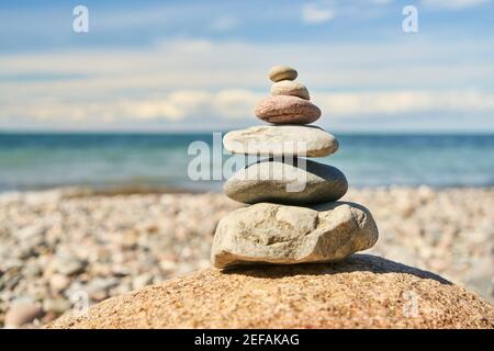 Stacked stones as a zen meditation concept on the beach of the Baltic Sea Stock Photo