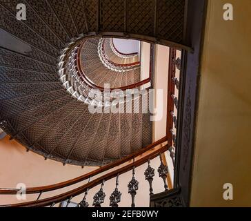 Wroclaw Poland April 16 2019 Lookup to metal old renovated spiral staircase Stock Photo