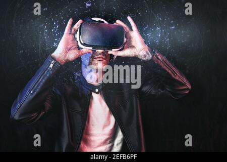 cyberman  using content in virtual reality glasses with dark isolated background Stock Photo