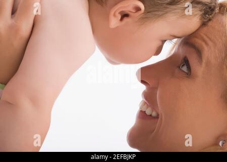Close up of a mid adult woman looking at her son and smiling Stock Photo