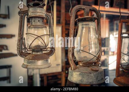 Old-fashioned oil lamp lantern used to illuminate a room Stock Photo