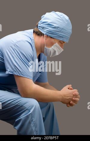 Side profile of a male surgeon thinking Stock Photo - Alamy