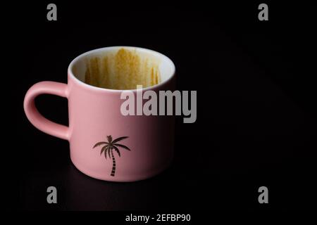 A Matte Pink Palm Tree Espresso Cup Stock Photo