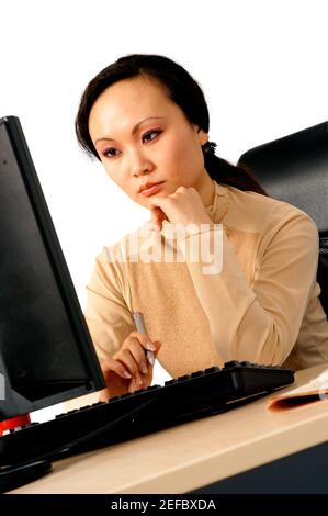 Young woman working on a computer Stock Photo