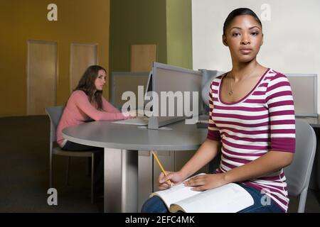 Two young men studying in a computer lab Stock Photo